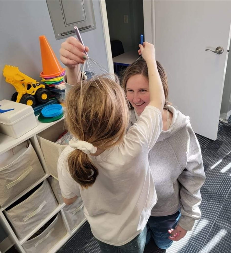 Meghan Schneider during a playful pediatric occupational therapy session